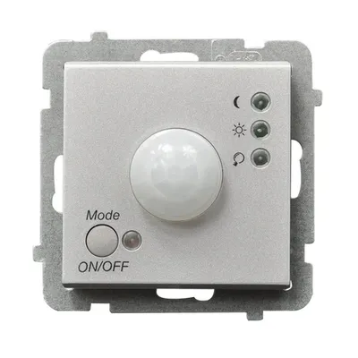 Elektroniczny czujnik ruchu Ospel Sonata, kolor srebrny matowy, z pokrętłem trybu i przyciskiem ON/OFF.