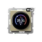 Regulator temperatury Wi-Fi Ospel Sonata RTE-1R/m/39 w kolorze szampańskiego złota z okrągłym wyświetlaczem pokazującym aktualną temperaturę i wilgotność.